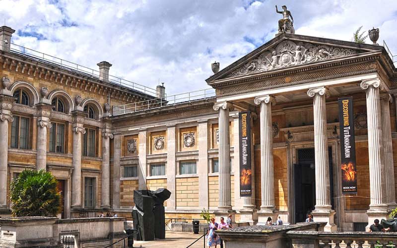 Exterior view of the Ashmolean Museum in Oxford, showcasing its neoclassical architecture.