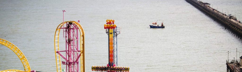 banner View of Southend Pier, the world's longest pleasure pier, extending into the Thames Estuary.