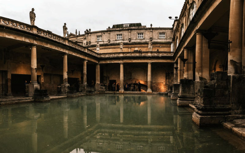 View of the Roman Baths with historic architecture in Bath, UK